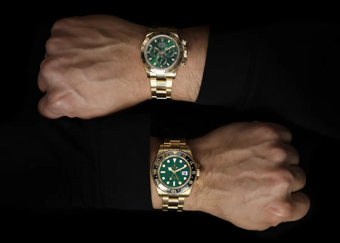 Photo of two wrists with Rolex watches on them